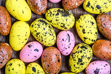 Colorful easter eggs on wooden background, overhead