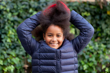 Pretty girl with long afro hair in the garden