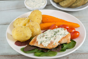 Grilled Chicken steak topping spinach sauce with vegetable and b