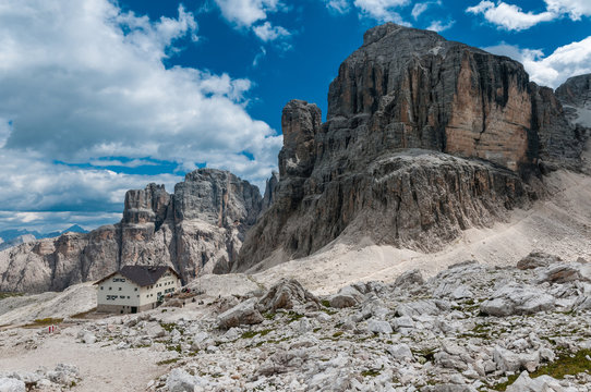 Scenic view of Dolomites mountains with dramatic clouds.