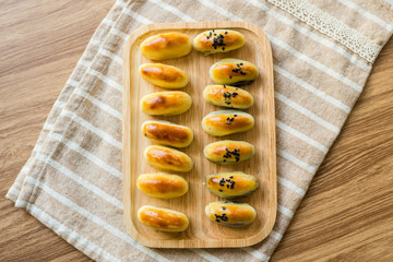 Chinese Pastry row on wooden tray