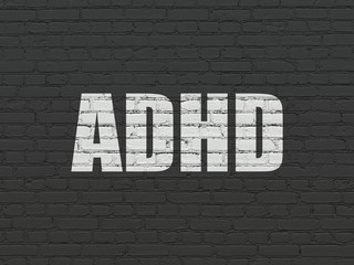 Healthcare concept: ADHD on wall background