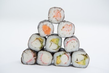 Maki sushi arranged on white background