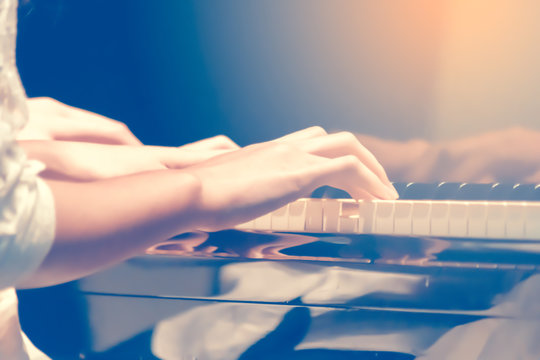 Vintage Close up Musician's hand or finger playing Piano