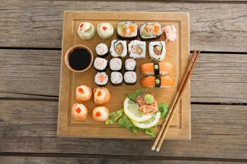 Set of assorted sushi served on wooden tray