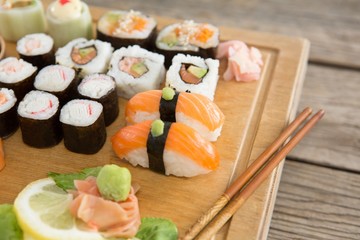 Set of assorted sushi served on wooden tray