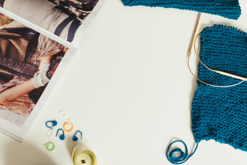 knitting, yarn, knitting needles on the table. texture of knitte