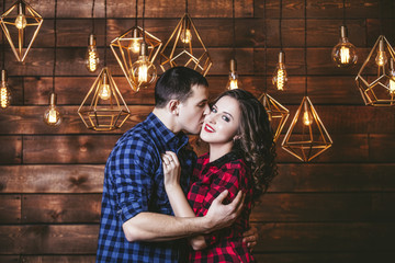Couple man and woman beautiful and happy and in a interior with