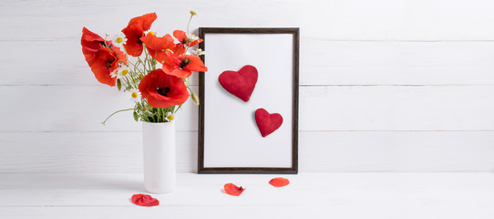 Card for Valentine Day. Red poppies bouquet in vase and frame