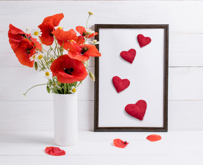 Card for Valentine Day. Red poppies bouquet in vase and frame