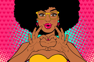 Wow pop art face. Sexy young african american woman with lips in form of kiss and afro hairstyle in glasses shows love heart sign. Vector colorful invitation poster in pop art retro comic style.