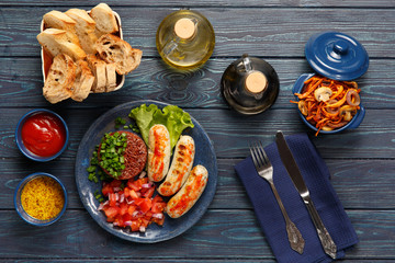 Fried sausages and boiled red rice seasoned with fresh onion and tomatoes. Jugged carrot, onion and mushrooms.