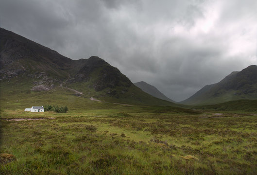 Little white house in Scottish mountains