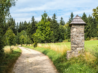 Stone chapel on pathway in europian countryside