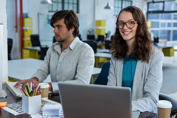 Graphic designers working at desk