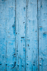 Fototapeta na wymiar Outside wall of blue wooden planks