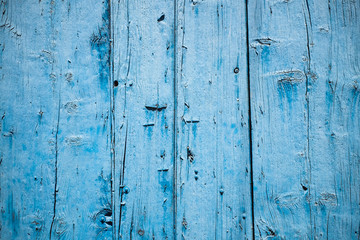 Outside wall of blue wooden planks
