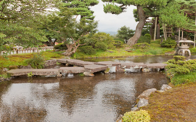 Fototapeta na wymiar Gankobashi Bridge in Kenrokuen Garden of Kanazawa, Japan