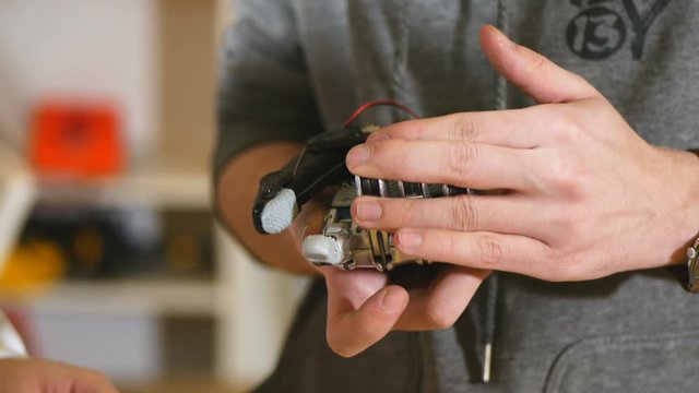 Crafting robotic bionic arm made on 3D printer. 4K.