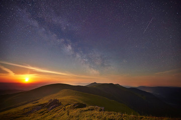 Starry sky over the summer mountains
