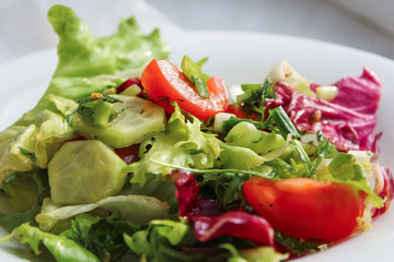 plate of fresh salad. Bon appetit