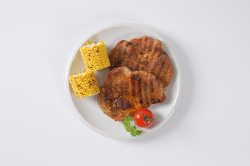 grilled pork and corn cob