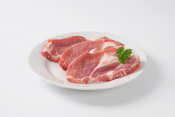 raw pork neck steaks
