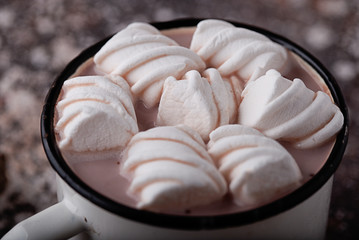 close-up cup of cocoa with marshmallows