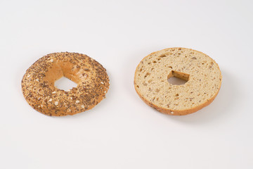 halved bagel with seeds