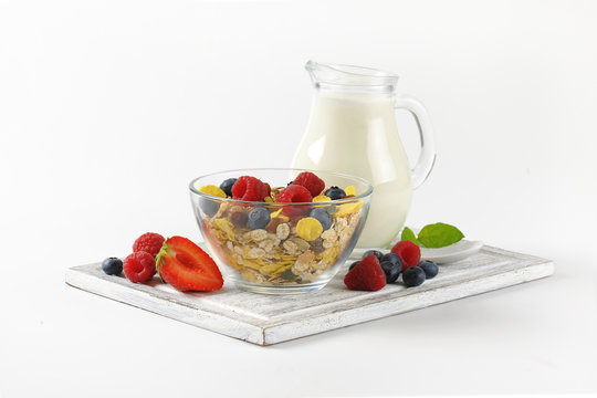 Bowl Of Cereals And Berry Fruit With Milk