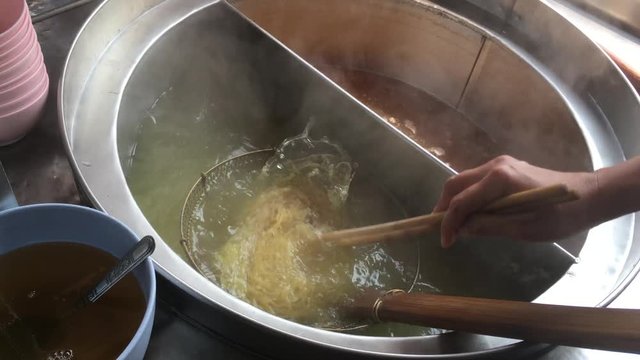 Cooking Chinese noodle,a local food at Thailand