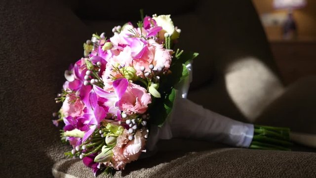Wedding bouquet of fresh flowers lies on the couch. Wedding bridal bouquet.