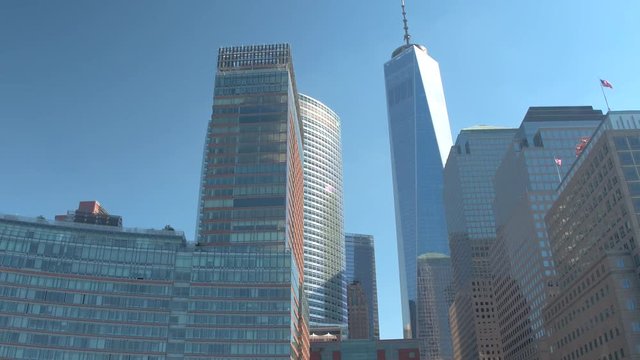 CLOSE UP: Tall glassy contemporary skyscrapers & rebuilt One World Trade Center