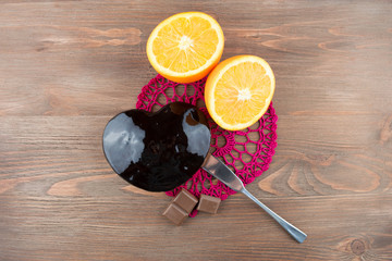 Orange cake in the shape of a heart on a crochet doily