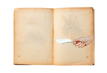 Open old book with image of Hand holding thai traditional knife with talisman symbol on it isolated on white background