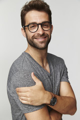Glasses guy in grey t-shirt, smiling