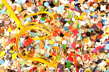Carnival background, colored confetti and streamers, from above
