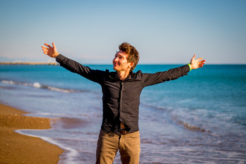 A handsome man on the beach