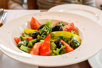 Fresh Greek salad closeup in a restaurant