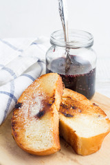 toast and jam closeup on white background