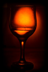 a glass of wine and splashes