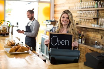 waitress standing at counter and showing slate