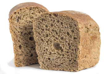 two halves of a black square cut bread brick