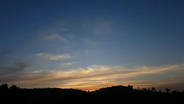 time lapse clouds in the morning with silhouette mountain before raining, 1080p