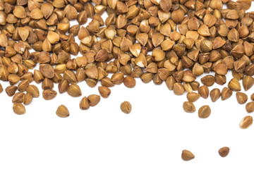 Pile of buckwheat seeds isolated over the white background