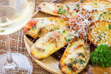 Mussels baked with cheese and garlic ,toasts with basil and garl