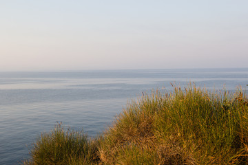 Landscape ofsSunset on the rocky sea beach