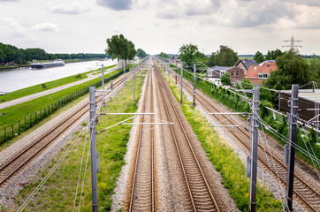 Obraz na płótnie Canvas Railway Tracks on a Cloudy Spring Day