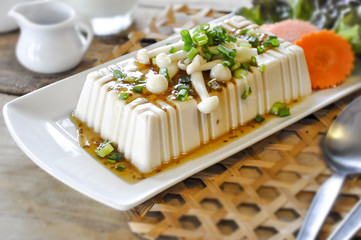 tofu with milk on the wooden table