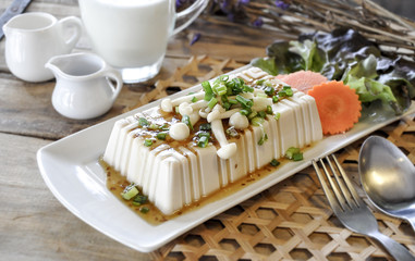 tofu with milk on the wooden table